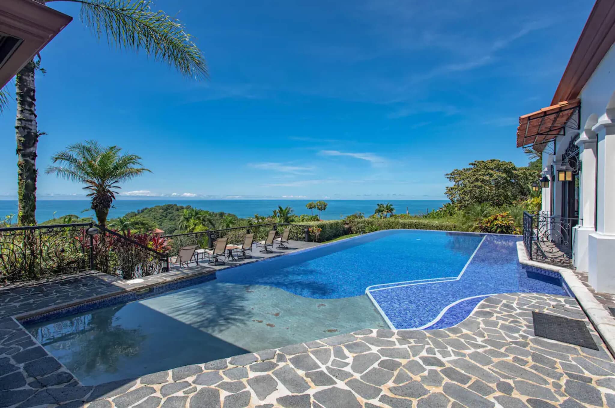 Luxury villa infinity pool overlooking the ocean at golden hour, Costa Rica